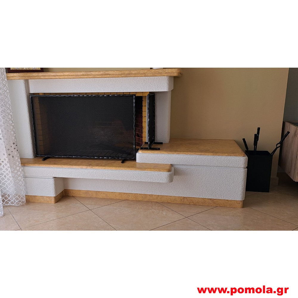 218 Κάλυψη τζακιού απο μασίφ σφυρίλατη βέργα σε όψη ξύλου τριανταφυλλιάς